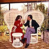 Stock Photo of Couple Man Woman Party Talking Conversation Drinking